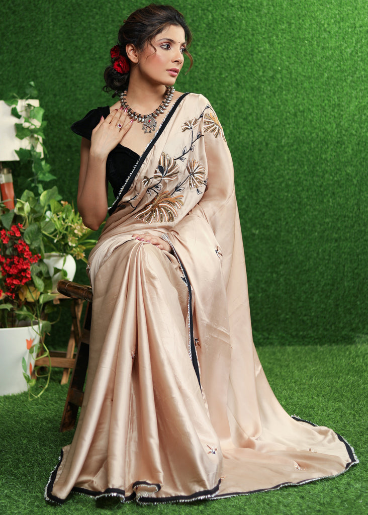 Exclusive cream Satin saree with delicate handwork & black border
