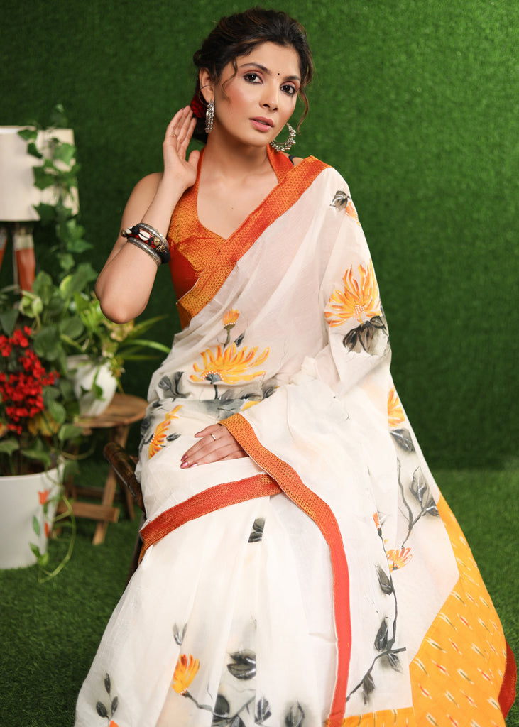 Elegant white saree with classy floral hand painting with Khun border