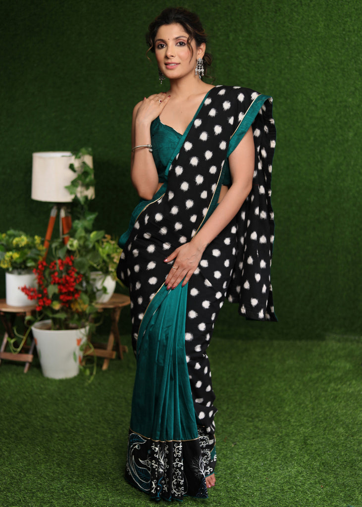 Exquisite black double Ikat & turquoise combination saree with hand painted Gond border