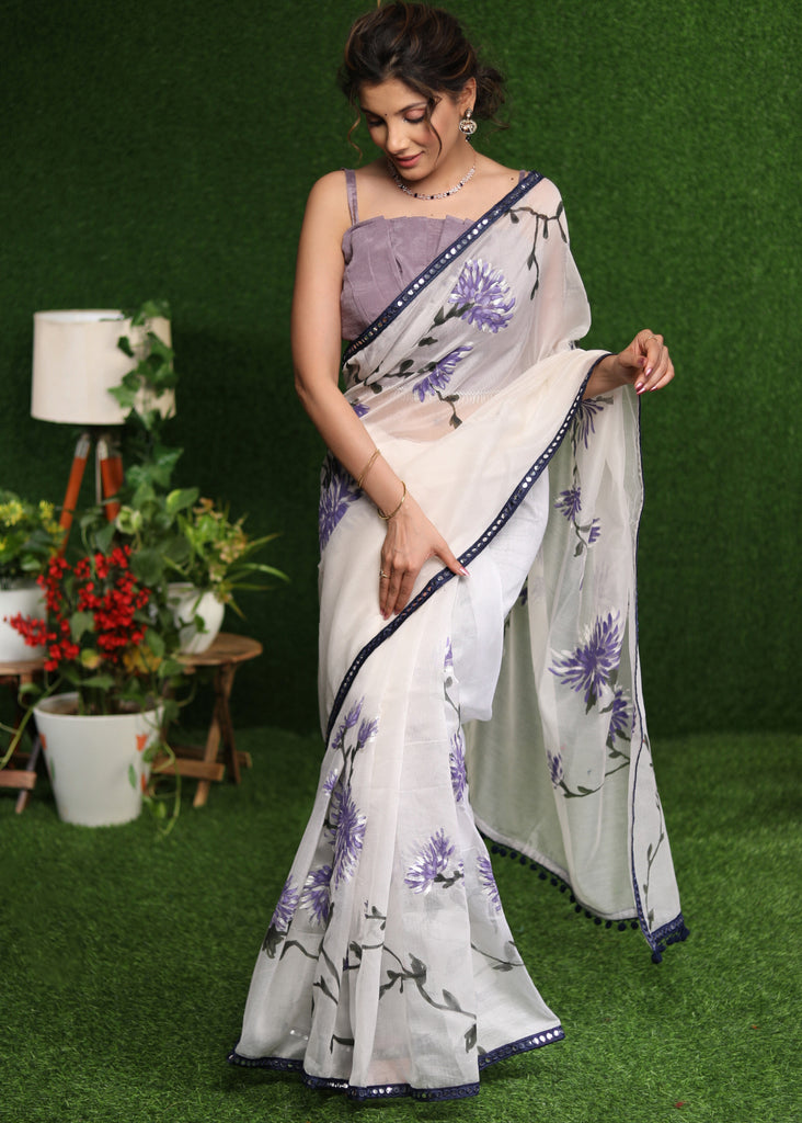 Designer white saree with lavender hand painting and Mirror work border