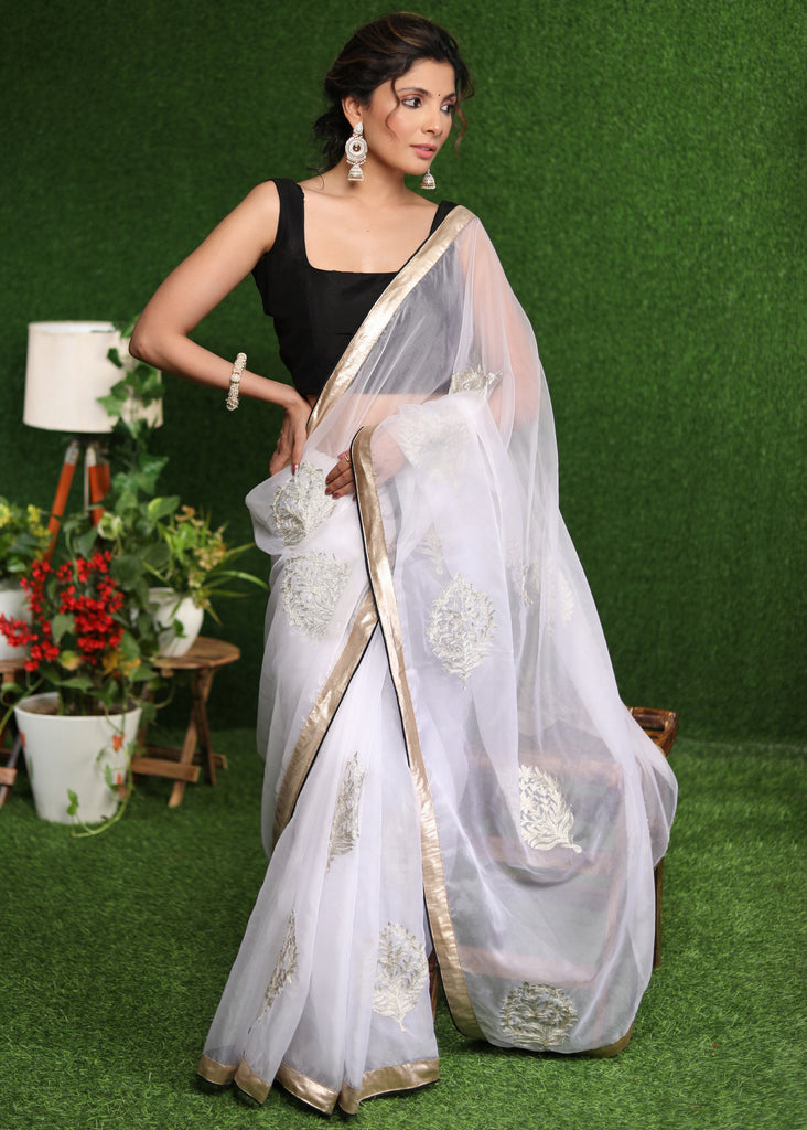 Beautiful white Organza saree with golden classy Zari embroidery & border