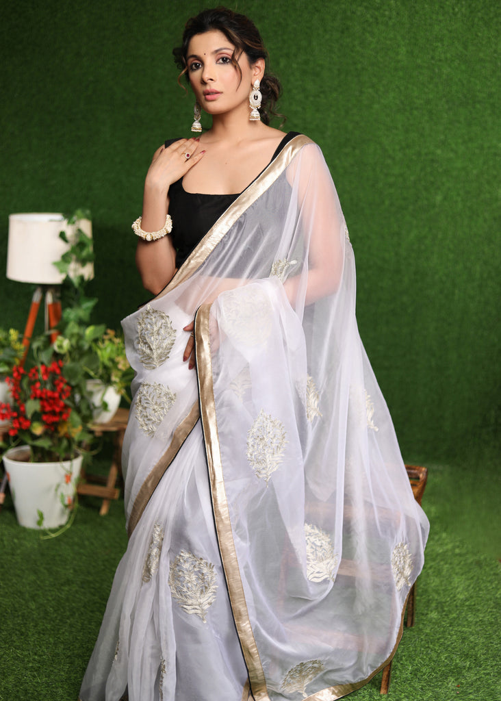 Beautiful white Organza saree with golden classy Zari embroidery & border