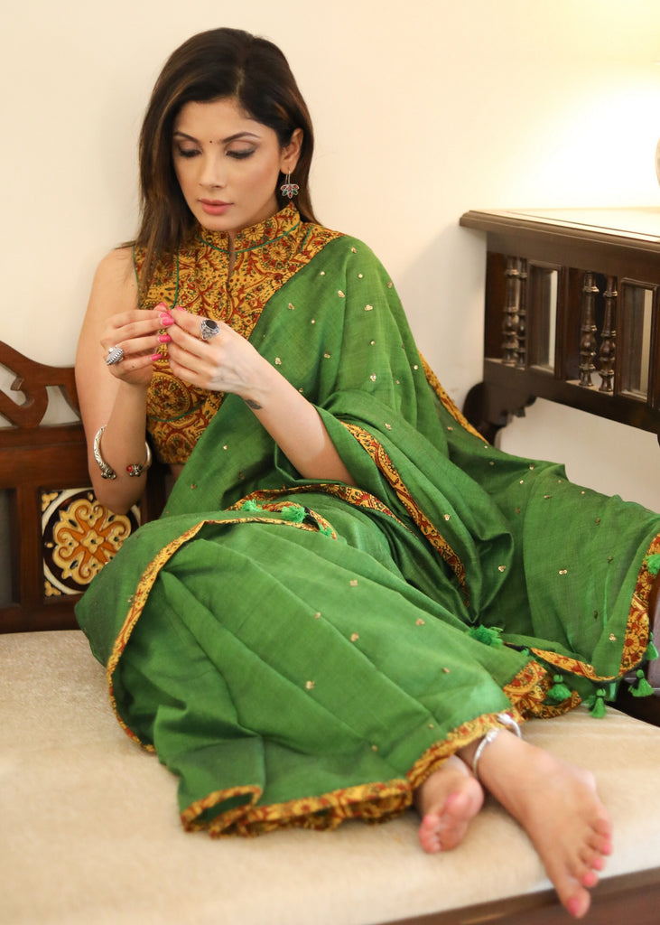 Graceful green Cotton saree with yellow Ajrakh border and golden embellishment
