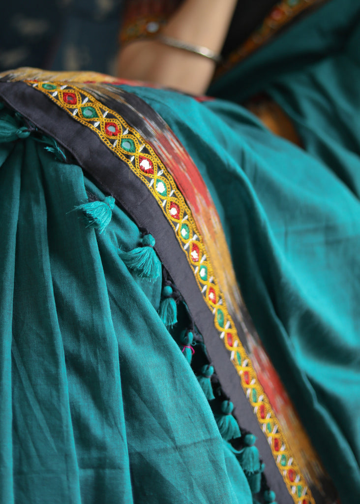 Comfortable peacock green Cotton saree with beautiful mirror work & Ikat border