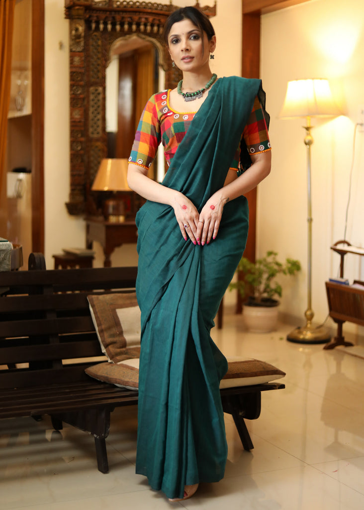 Elegant plain peacock green cotton saree with multicolor blouse piece