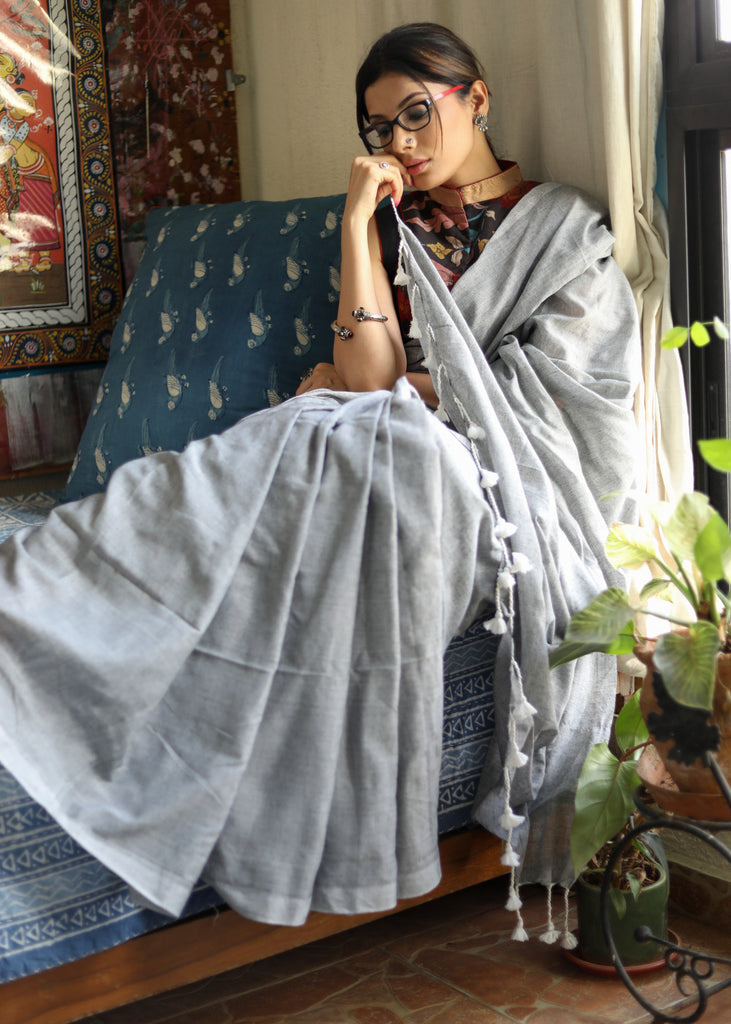 Breezy slate grey Cotton saree with white tassel and Kalamkari blouse piece
