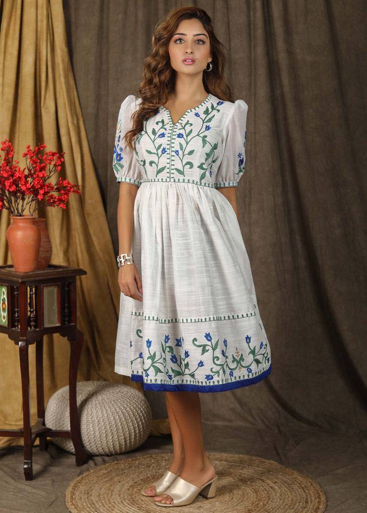 Stylish classic white cotton silk gathered dress with elegant embroidery paired with chanderi sleeves