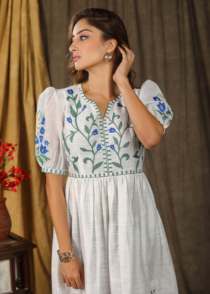 Stylish classic white cotton silk gathered dress with elegant embroidery paired with chanderi sleeves