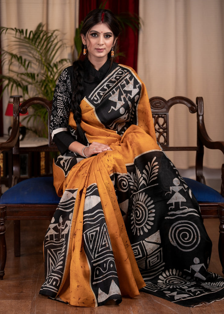 Exclusive pure silk hand batik mustard yellow saree with warli design motifs