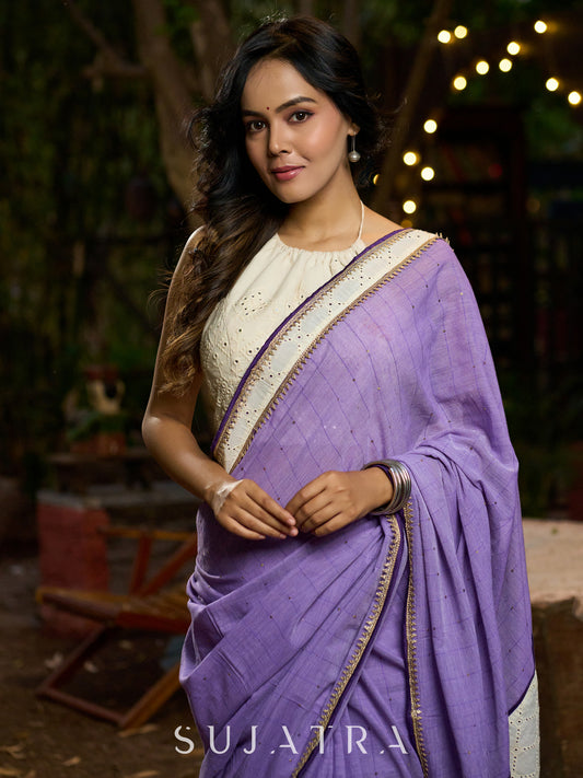 Elegant lilac cotton saree with golden accents and soft handcrafted sophistication