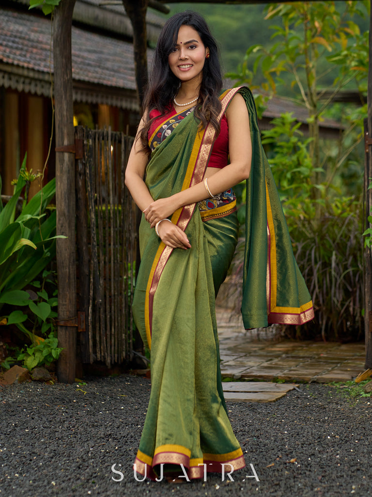 Exclusive green tissue saree with hand painted kalamkari borders & maharashtrian khun border