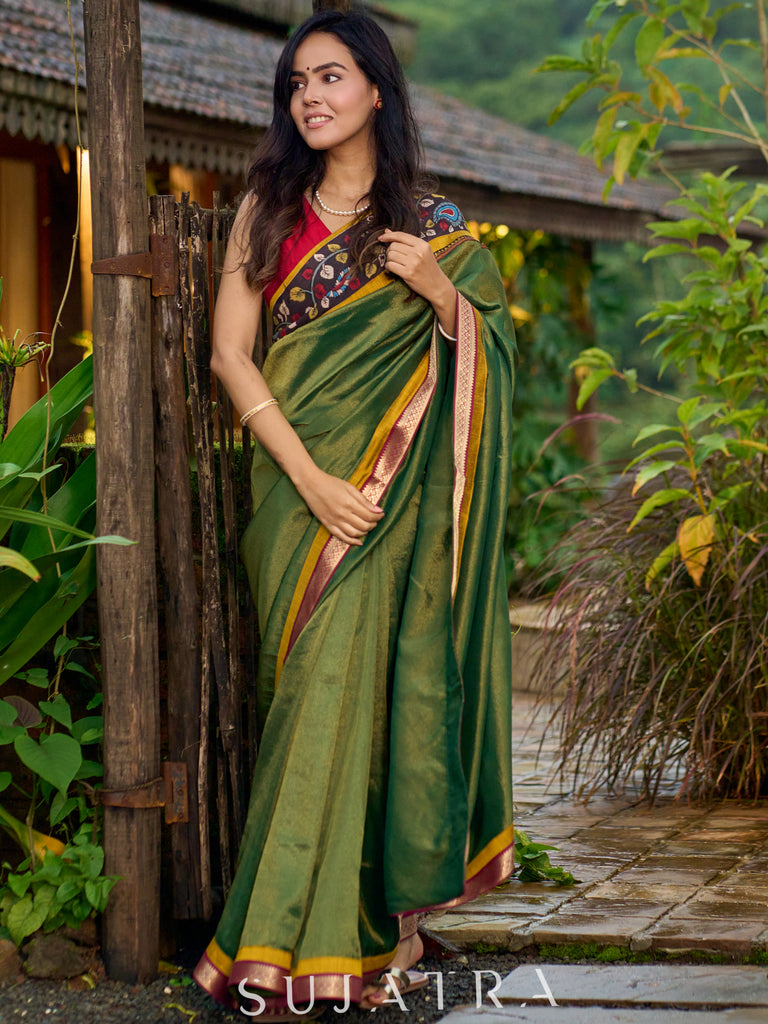 Exclusive green tissue saree with hand painted kalamkari borders & maharashtrian khun border