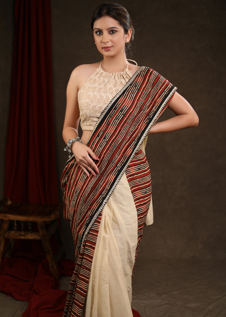 Charming Cream Cotton Half & Half Saree with Strip Combination Highlighted with Zari Border