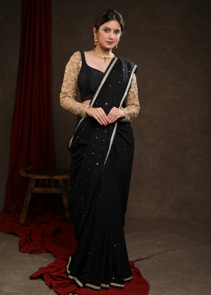 Classy Black Rayon Saree Adorned with Delicate Gold Hand Embroidery & Lace