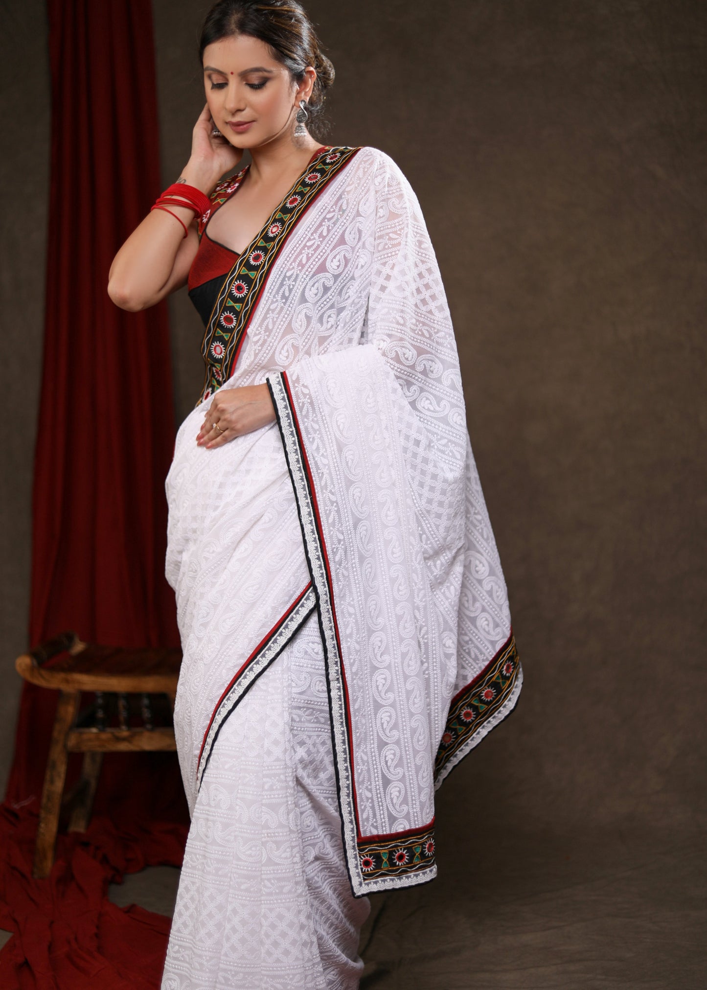 Heavy Chikankari Work Georgette White Saree Highlighted with Elegant Mirrorwork Lace
