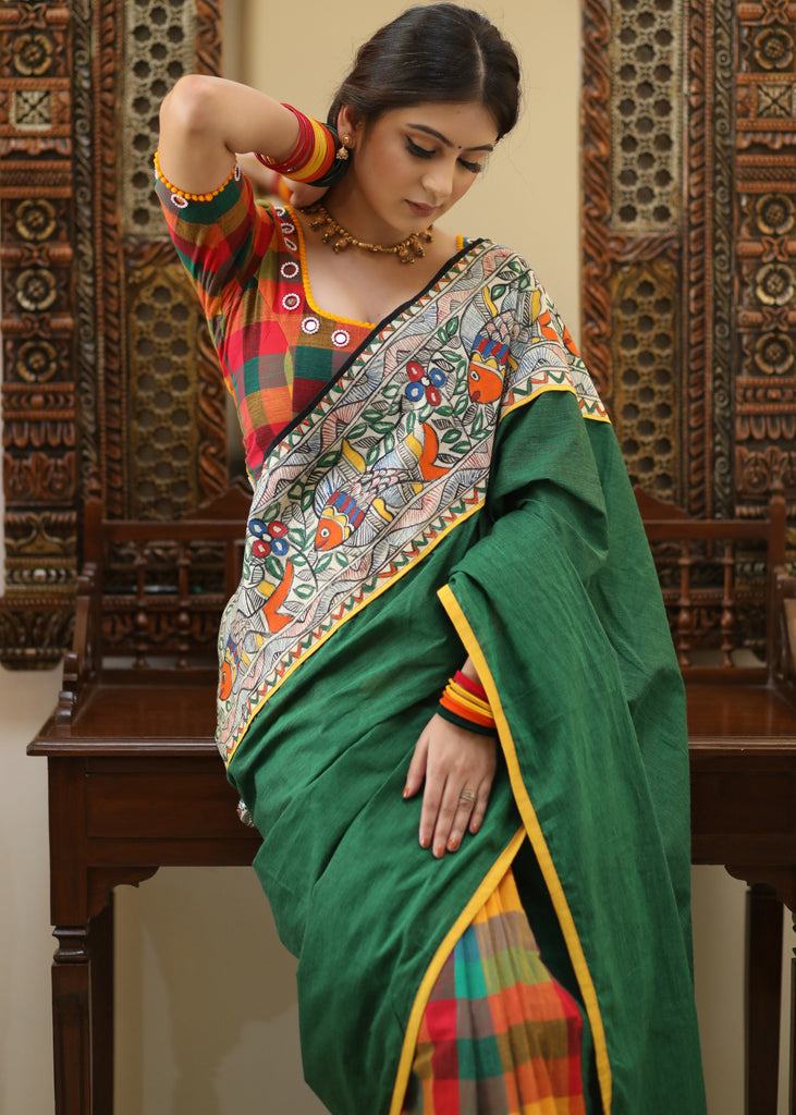 Standout checks Cotton saree adorned with Madhubani hand painted border.