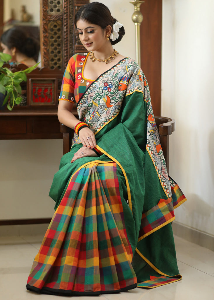 Standout checks Cotton saree adorned with Madhubani hand painted border.