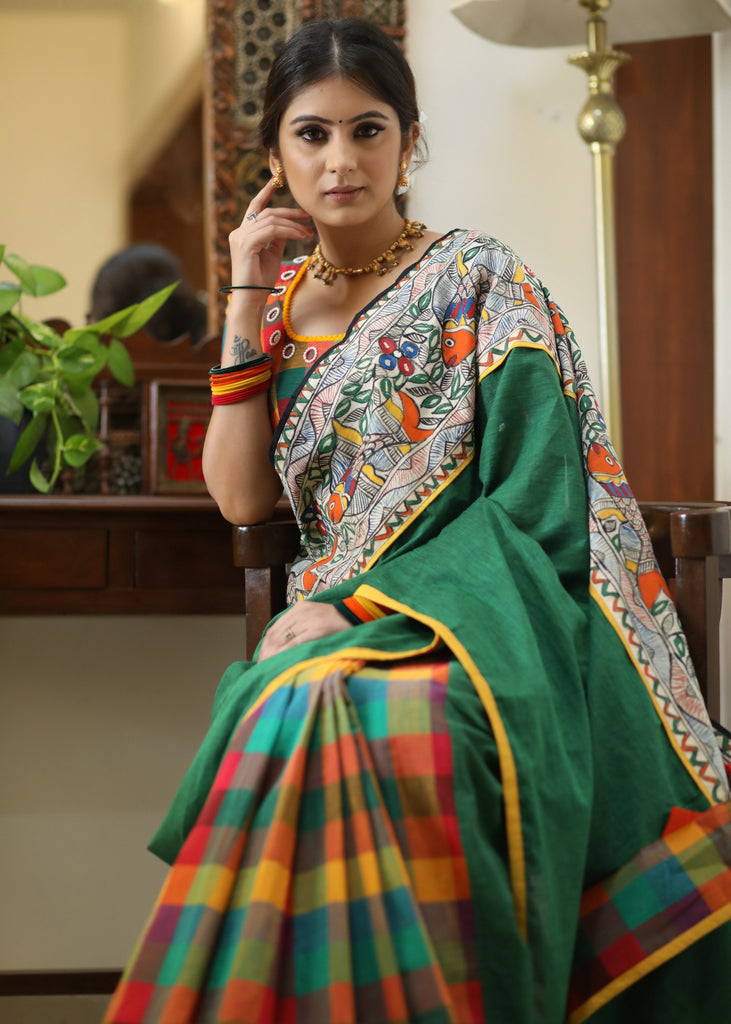 Standout checks Cotton saree adorned with Madhubani hand painted border.