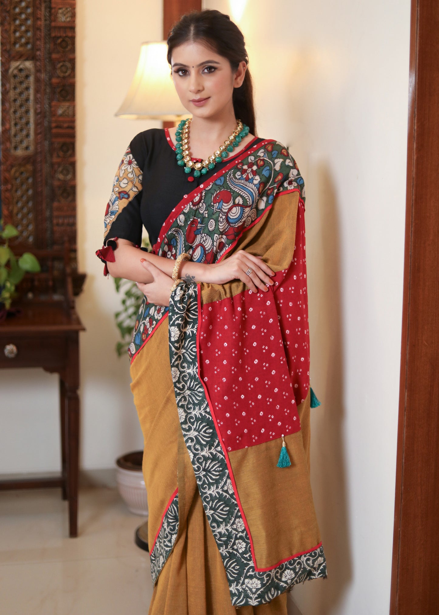 Beautiful mustard Cotton saree with Kalamkari hand painted border, red Bandhani Pallu and tassels