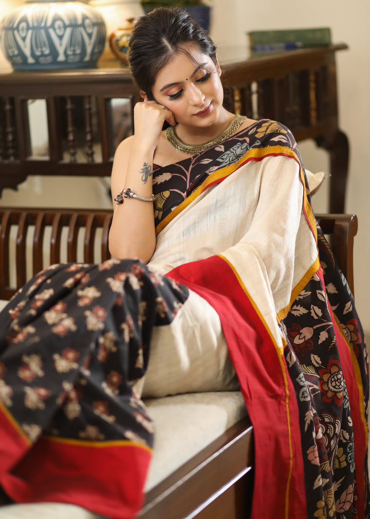 Mesmerizing black printed saree with Kalamkari hand painted Pallu and border