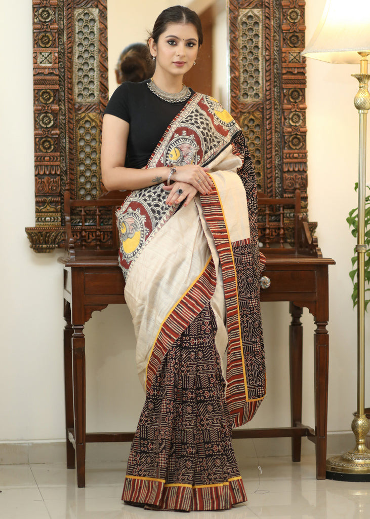 Elegant Cotton Ajrakh saree with Chanderi Pallu adorned with Madhubani painting.