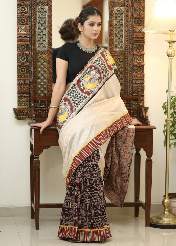 Elegant Cotton Ajrakh saree with Chanderi Pallu adorned with Madhubani painting.