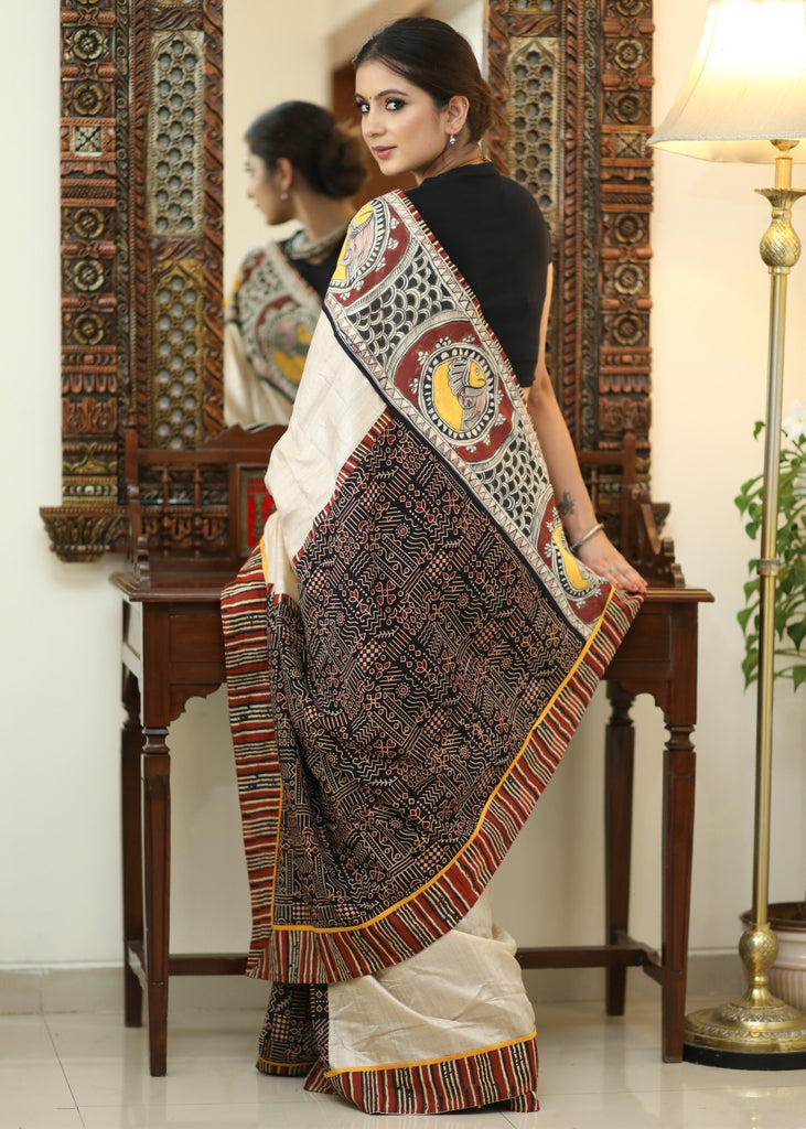 Elegant Cotton Ajrakh saree with Chanderi Pallu adorned with Madhubani painting.