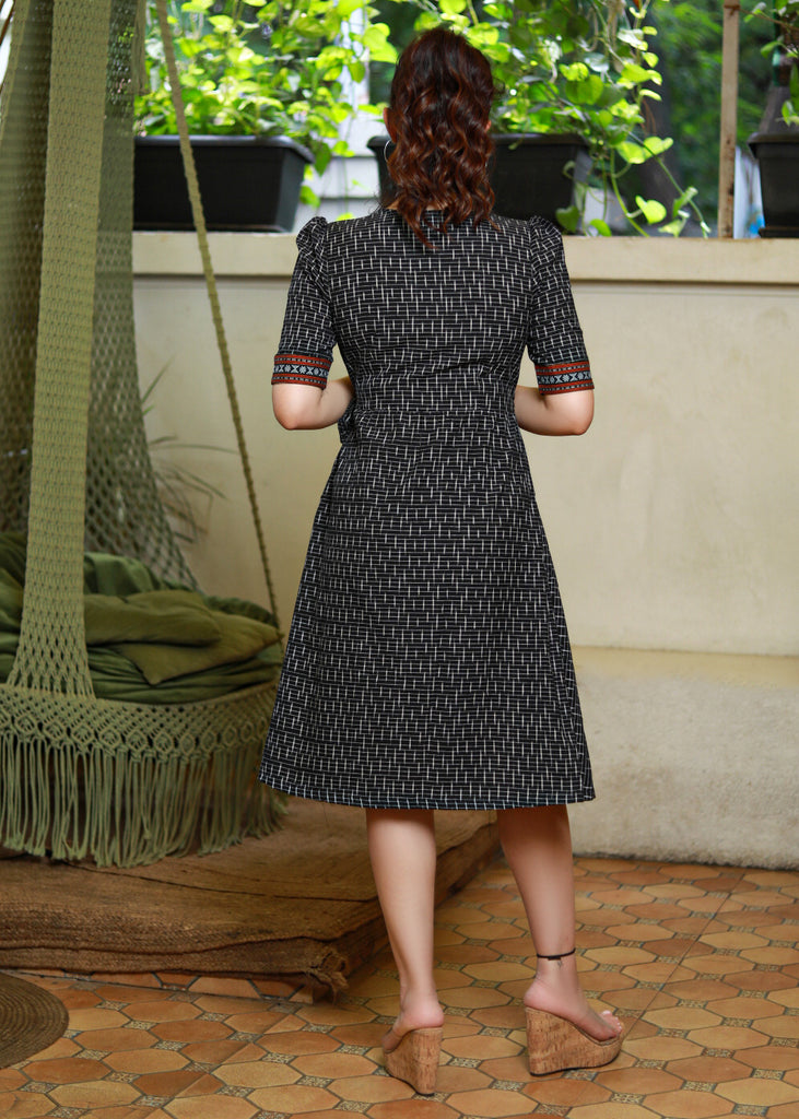 Trendy Black Ikat Overlap Dress Highlighted with Matching Ikat Border
