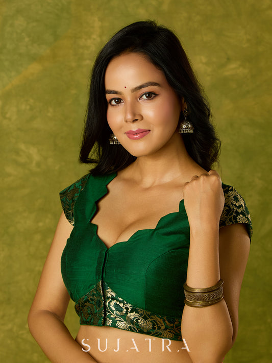 Festive dark green cap sleeve blouse with rich Banarasi combination