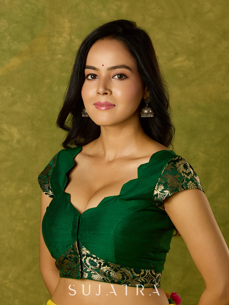 Festive dark green cap sleeve blouse with rich Banarasi combination