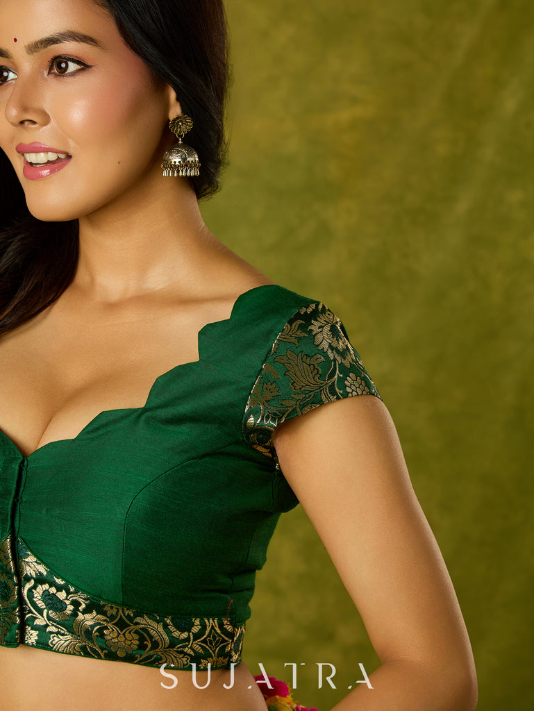 Festive dark green cap sleeve blouse with rich Banarasi combination