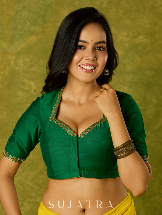 Gracefully hand embroidered forest green cotton silk blouse.