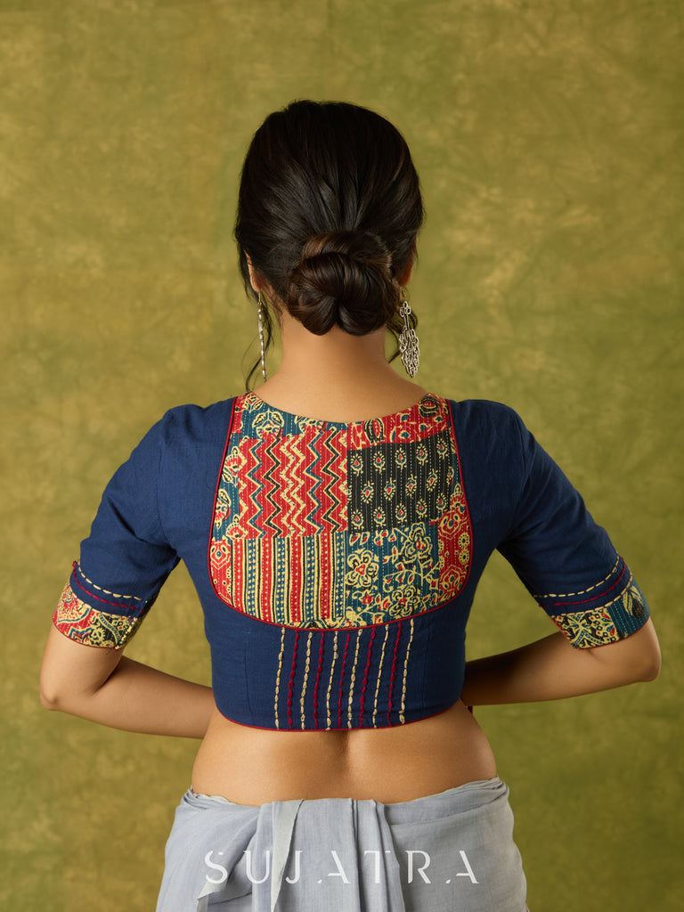 Beautifully hand embroidered navy blue blouse with stylish fabric combination.