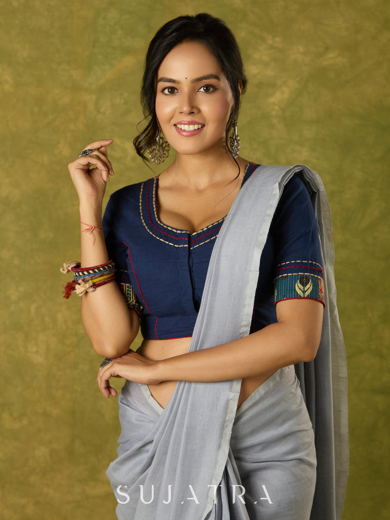 Beautifully hand embroidered navy blue blouse with stylish fabric combination.