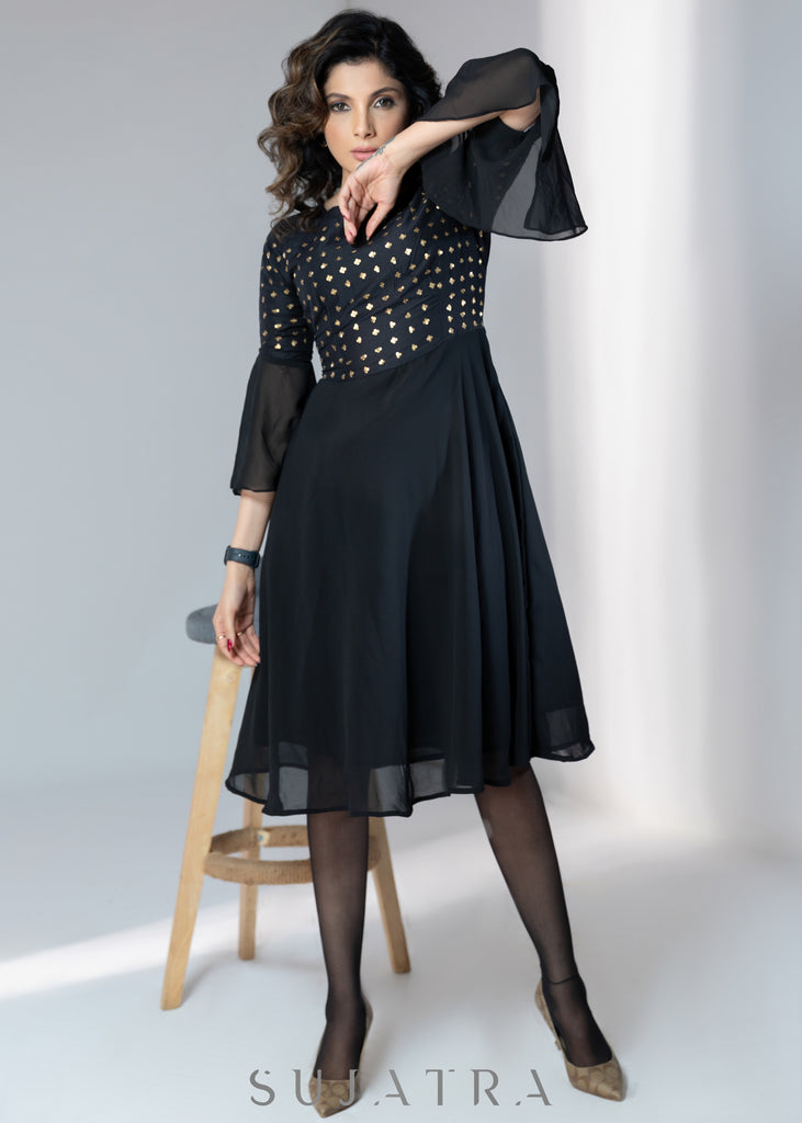 Evening wear Black georgette dress with gold sequence work