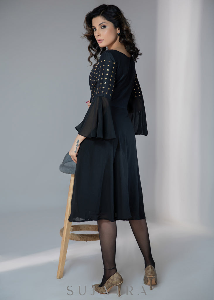 Evening wear Black georgette dress with gold sequence work