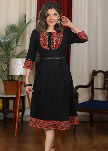 Black cotton flared dress with ajrakh combination highlighted with mirror lace