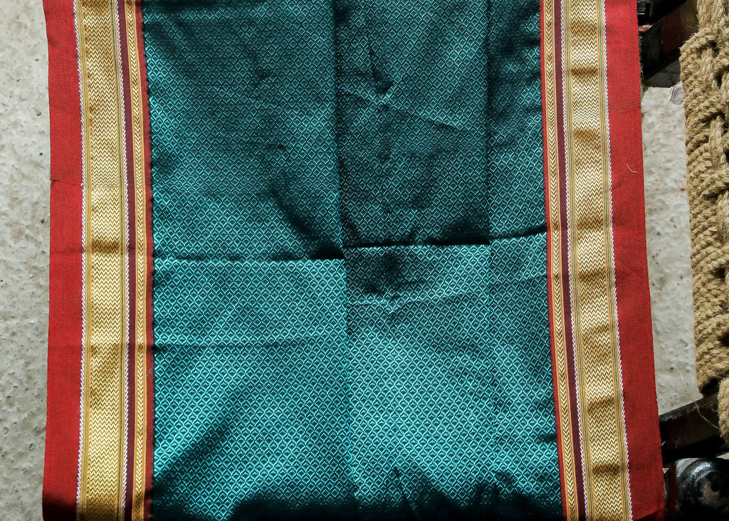 Beautiful Intricate Bluish Green Khun Fabric with contrast border and subtle Sheen
