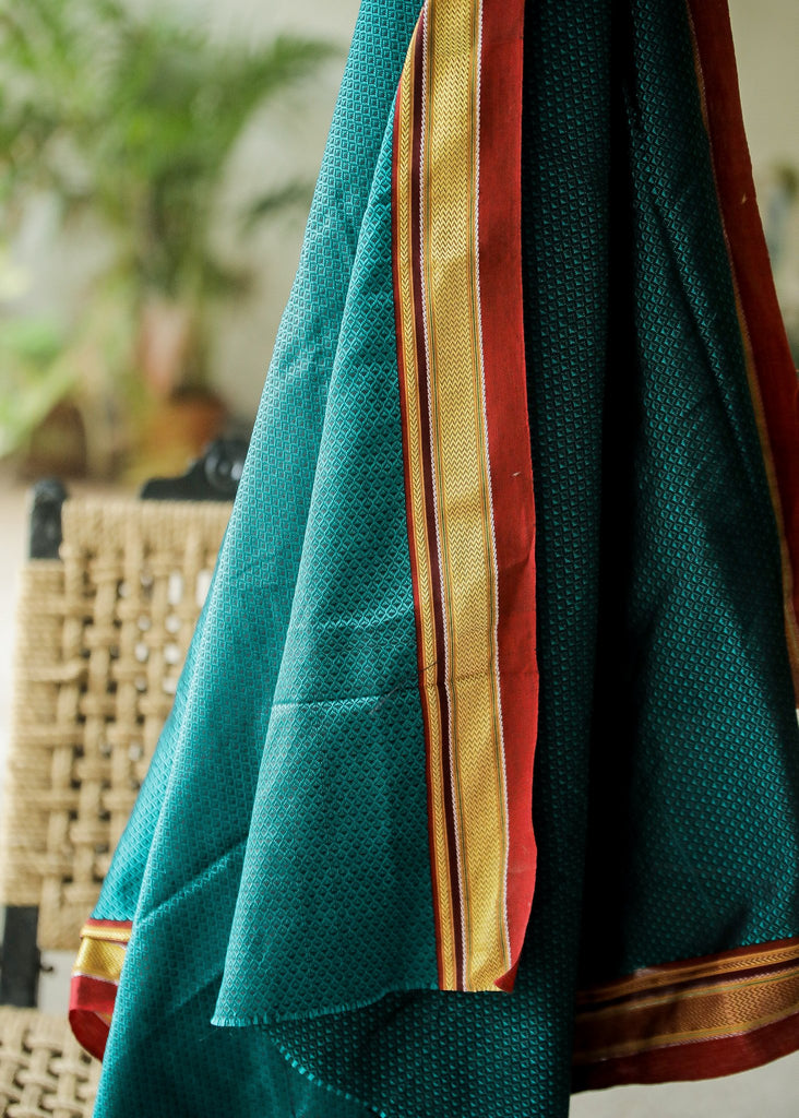 Beautiful Intricate Bluish Green Khun Fabric with contrast border and subtle Sheen