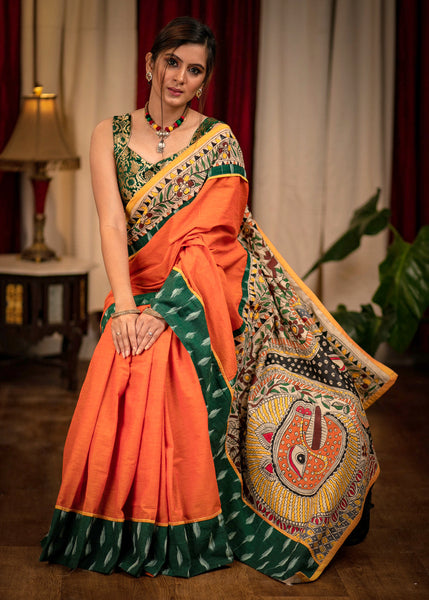 Orange handloom cotton saree with hand painted madhubani pallu and ikat border