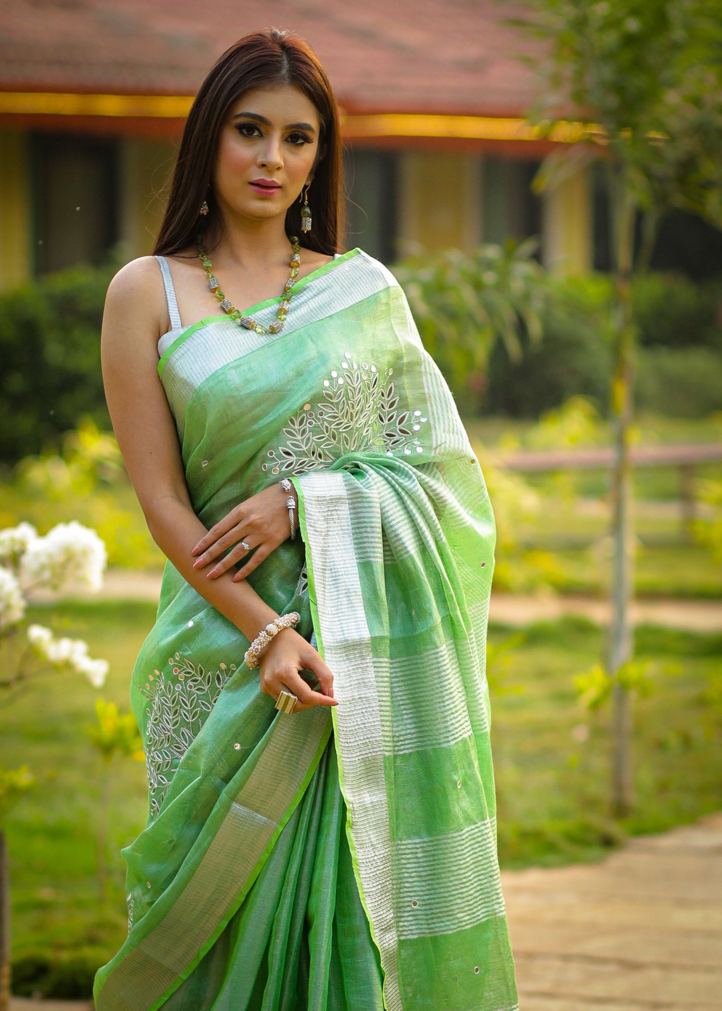 Exclusive pure silk linen pista green cutwork saree with mirror work embellishments