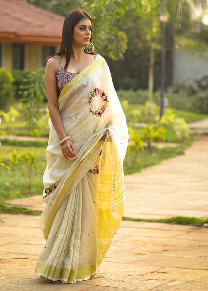 Exclusive beige pure linen saree with intricate embroidery & mirror work embellishments