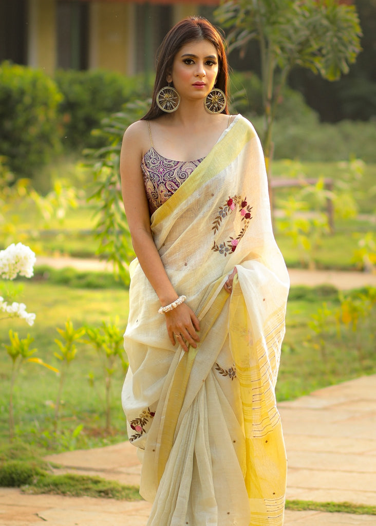 Exclusive beige pure linen saree with intricate embroidery & mirror work embellishments