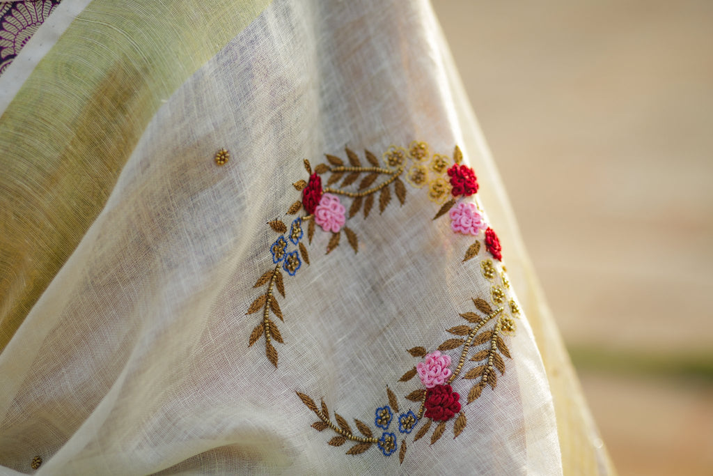 Exclusive beige pure linen saree with intricate embroidery & mirror work embellishments