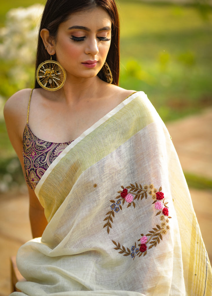 Exclusive beige pure linen saree with intricate embroidery & mirror work embellishments