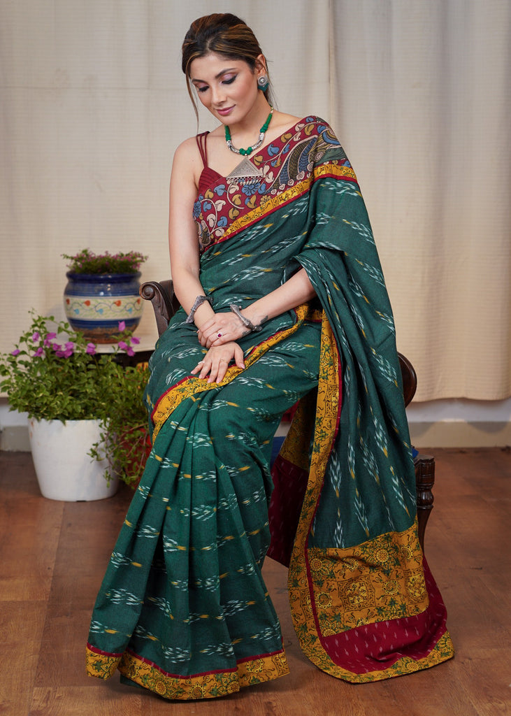 Elegant green Ikkat cotton saree with exclusive hand painted Kalamkari border