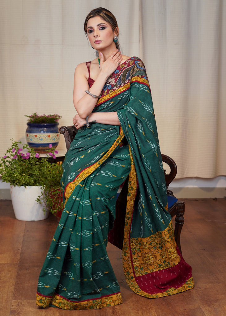 Elegant green Ikkat cotton saree with exclusive hand painted Kalamkari border