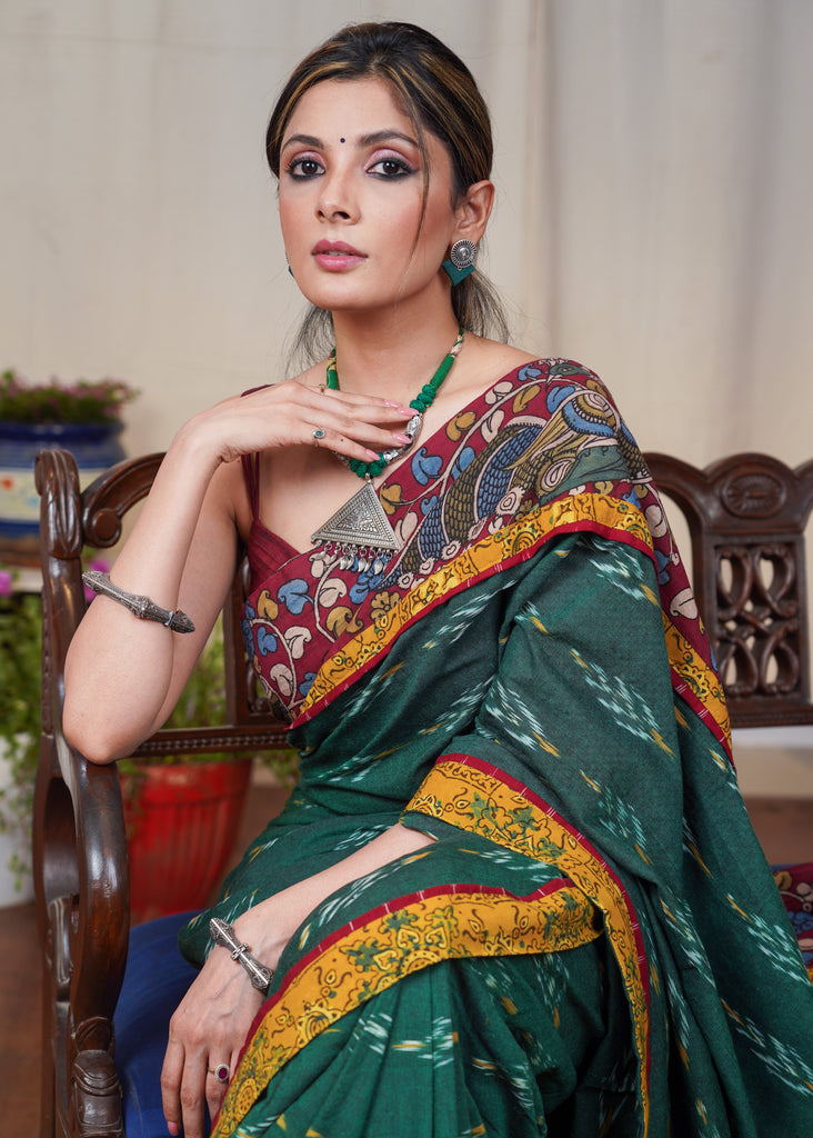 Elegant green Ikkat cotton saree with exclusive hand painted Kalamkari border