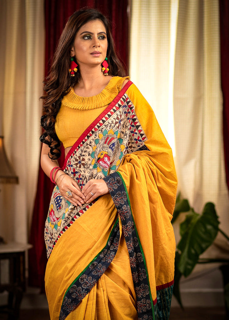 Mustard handloom cotton saree with hand painted madhubani patch and sambalpuri ikat pallu