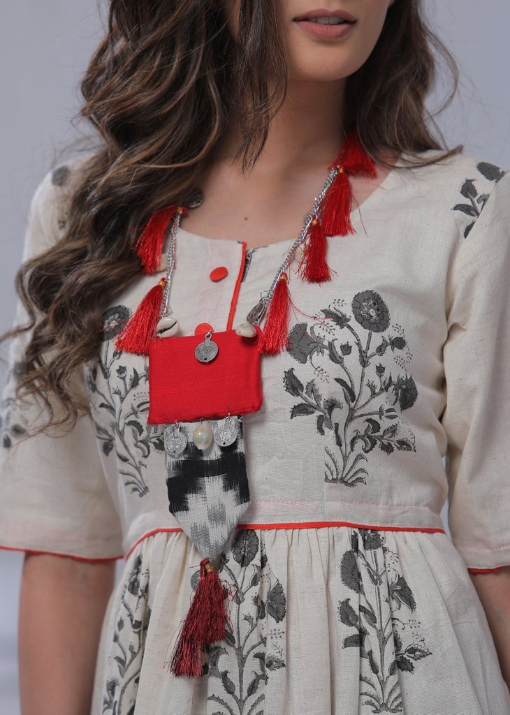 Handmade ikkat and cotton pendant with threads, coins, tassels & cowrie neckpiece - Sujatra